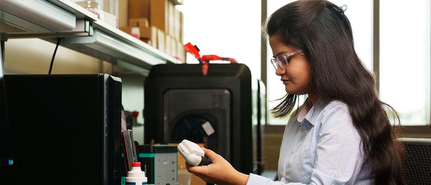 A young woman working with electrical equipment